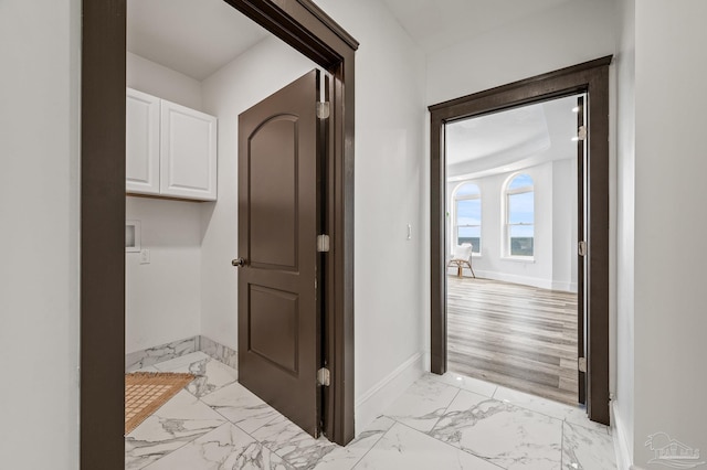502 Deer Point Dr, Gulf Breeze, FL 32561 - hallway with light marble finish floors and baseboards