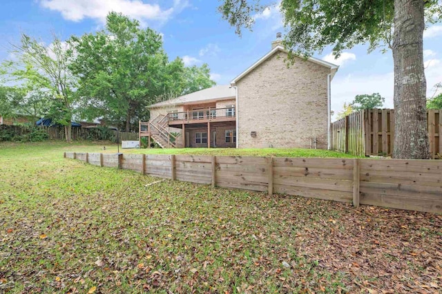 1011 Bucyrus Ln, Cantonment, FL 32533 - rear view of property with stairs, brick siding, a chimney, and a deck