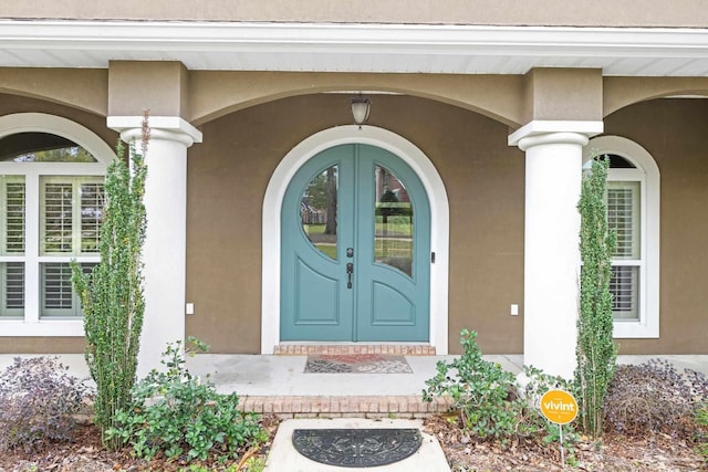 1011 Bucyrus Ln, Cantonment, FL 32533 - entrance to property featuring french doors and stucco siding