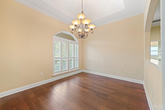 1011 Bucyrus Ln, Cantonment, FL 32533 - empty room featuring a chandelier, dark wood finished floors, crown molding, and baseboards