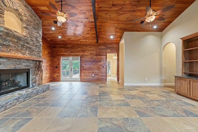 1011 Bucyrus Ln, Cantonment, FL 32533 - unfurnished living room featuring wood ceiling, a ceiling fan, high vaulted ceiling, baseboards, and a fireplace