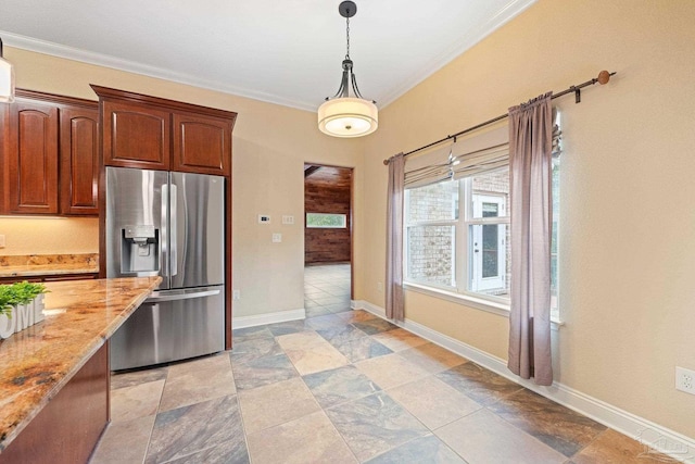 1011 Bucyrus Ln, Cantonment, FL 32533 - kitchen with stainless steel fridge with ice dispenser, light stone countertops, decorative light fixtures, ornamental molding, and baseboards