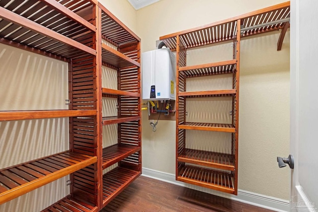 1011 Bucyrus Ln, Cantonment, FL 32533 - wine cellar with water heater, wood finished floors, and baseboards