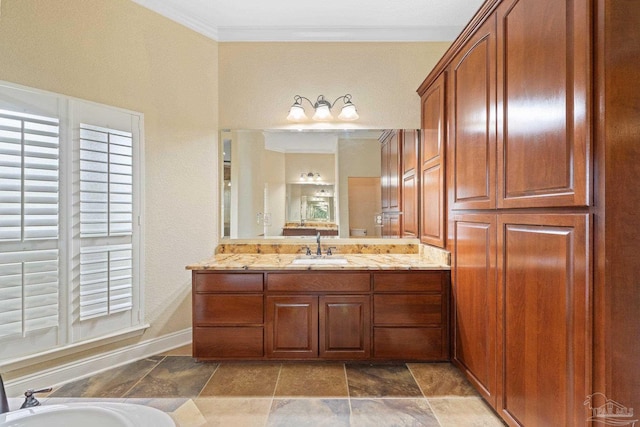 1011 Bucyrus Ln, Cantonment, FL 32533 - bathroom featuring vanity, ornamental molding, baseboards, stone finish flooring, and a bath