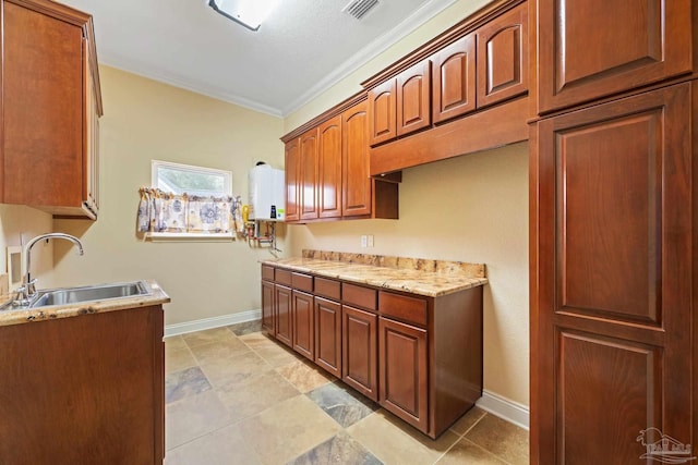 1011 Bucyrus Ln, Cantonment, FL 32533 - kitchen with a sink, baseboards, and ornamental molding
