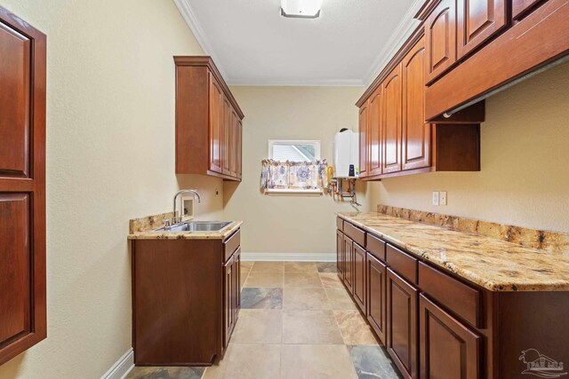 1011 Bucyrus Ln, Cantonment, FL 32533 - kitchen with a sink, ornamental molding, light stone counters, and baseboards