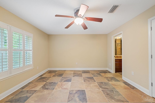 1011 Bucyrus Ln, Cantonment, FL 32533 - unfurnished room with stone finish flooring, a ceiling fan, and baseboards