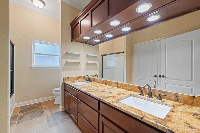 1011 Bucyrus Ln, Cantonment, FL 32533 - full bath with crown molding, double vanity, toilet, baseboards, and enclosed tub / shower combo