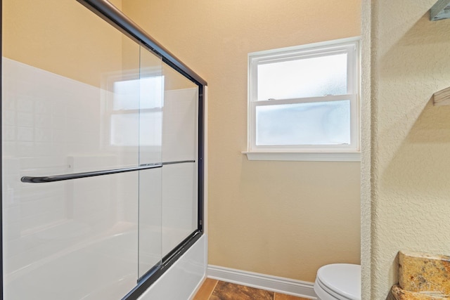 1011 Bucyrus Ln, Cantonment, FL 32533 - full bathroom with toilet, enclosed tub / shower combo, and baseboards