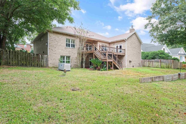 1011 Bucyrus Ln, Cantonment, FL 32533 - rear view of property featuring stairs, brick siding, a wooden deck, and a chimney