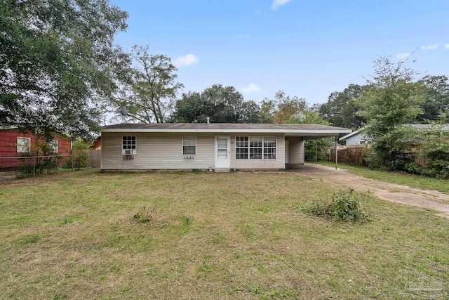 view of front of property with a front lawn and a carport