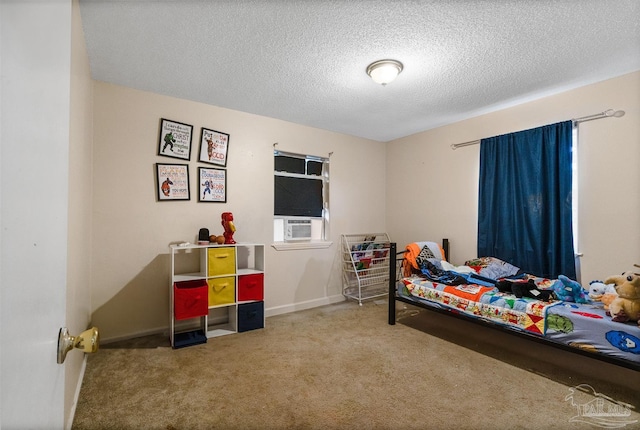 bedroom featuring carpet and a textured ceiling