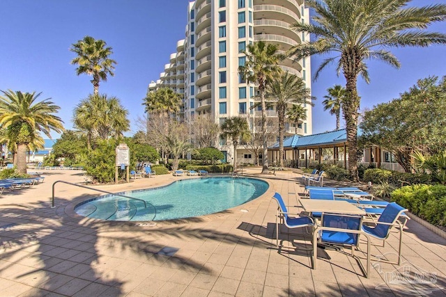 view of swimming pool featuring a patio area