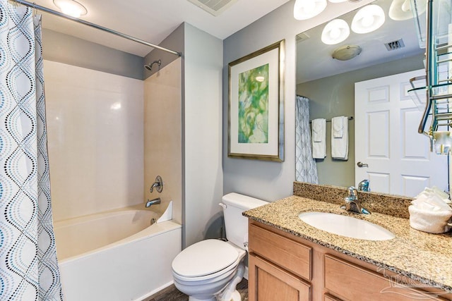 full bathroom with vanity, toilet, and shower / tub combo