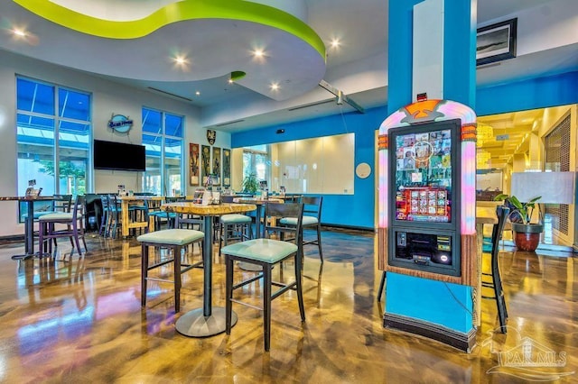 bar featuring concrete floors