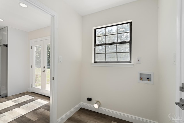 clothes washing area with baseboards, dark wood finished floors, laundry area, washer hookup, and french doors