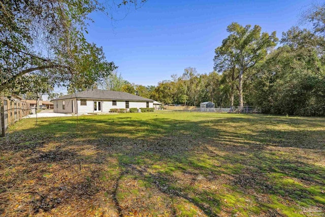 view of yard featuring a patio area and a fenced backyard