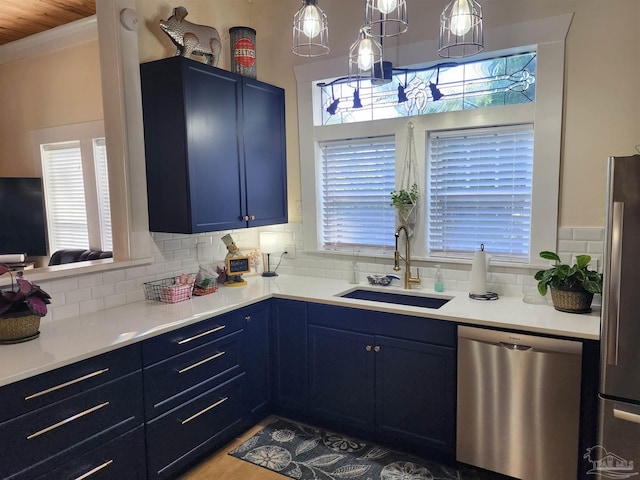 210 Mcrae St, Atmore, AL 36502 - kitchen featuring appliances with stainless steel finishes, blue cabinetry, and tasteful backsplash