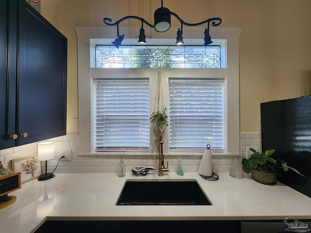210 Mcrae St, Atmore, AL 36502 - kitchen featuring decorative backsplash and light countertops
