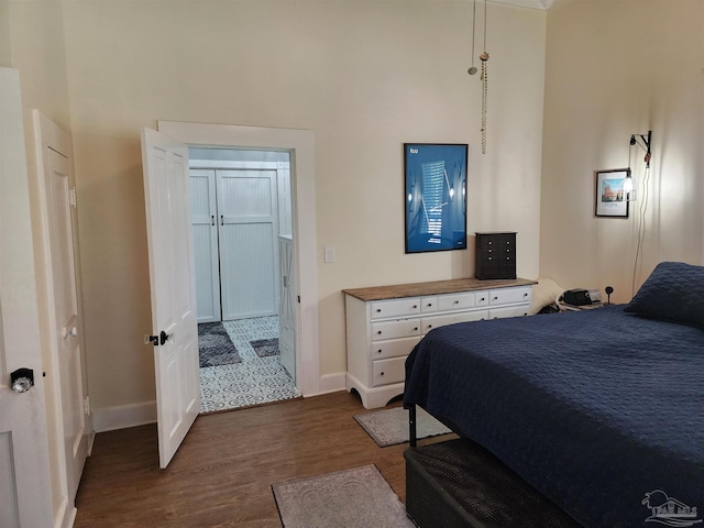 210 Mcrae St, Atmore, AL 36502 - bedroom featuring a towering ceiling and dark wood-style floors