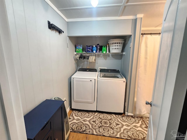 210 Mcrae St, Atmore, AL 36502 - laundry room featuring washing machine and dryer and wood finished floors