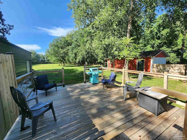 210 Mcrae St, Atmore, AL 36502 - deck featuring area for grilling and an outbuilding