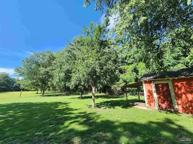 210 Mcrae St, Atmore, AL 36502 - view of grassy yard with an outdoor structure