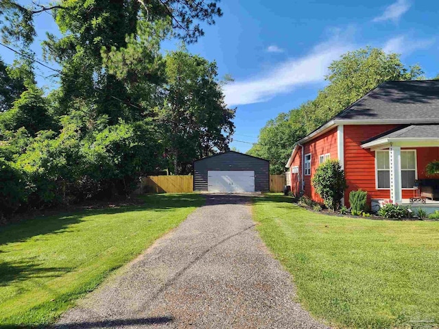 210 Mcrae St, Atmore, AL 36502 - view of property exterior featuring an outbuilding and a detached garage