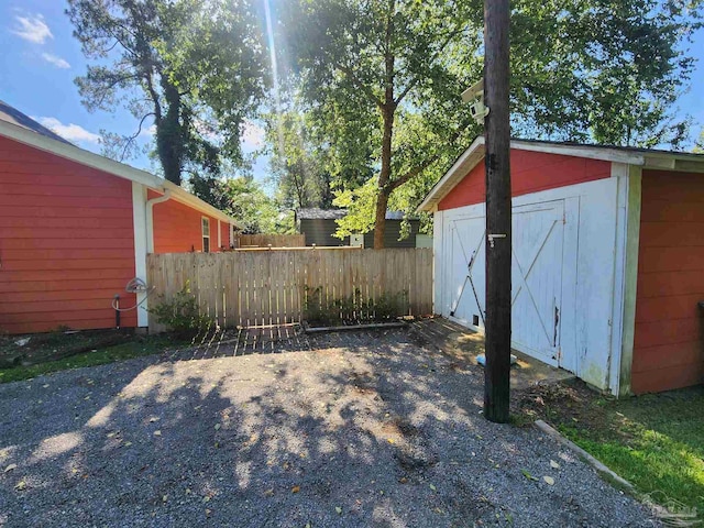 210 Mcrae St, Atmore, AL 36502 - view of patio with a storage unit
