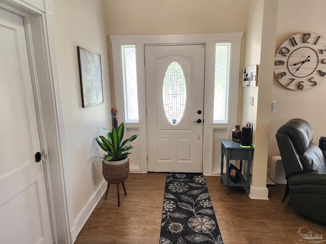 210 Mcrae St, Atmore, AL 36502 - foyer with dark wood-style floors and plenty of natural light