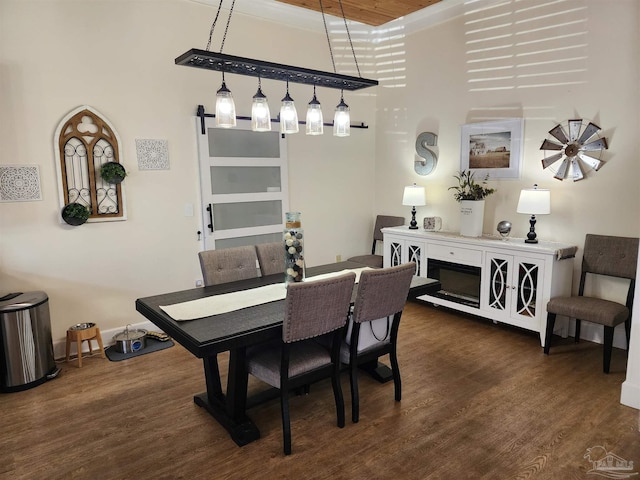 210 Mcrae St, Atmore, AL 36502 - dining room featuring dark wood-style flooring and a high ceiling