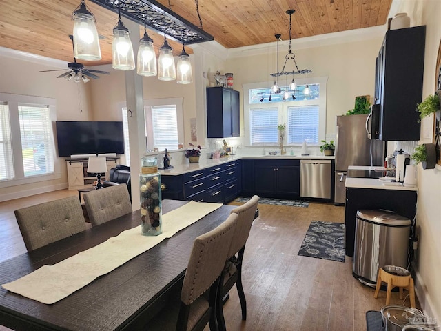 210 Mcrae St, Atmore, AL 36502 - dining room with wood ceiling, light wood-style floors, ornamental molding, ceiling fan, and a chandelier