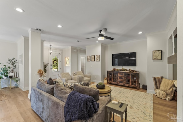 4979 Leeward Dr, Pensacola, FL 32507 - living room with baseboards, visible vents, light wood-style floors, and ornamental molding