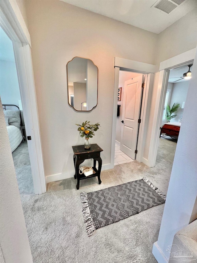 4979 Leeward Dr, Pensacola, FL 32507 - hallway featuring visible vents, carpet flooring, and baseboards
