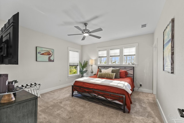 4979 Leeward Dr, Pensacola, FL 32507 - bedroom with light colored carpet, ceiling fan, baseboards, and visible vents