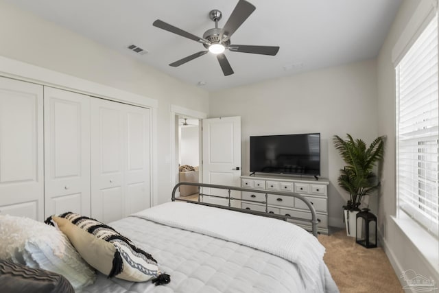 4979 Leeward Dr, Pensacola, FL 32507 - bedroom with a closet, visible vents, carpet flooring, and multiple windows
