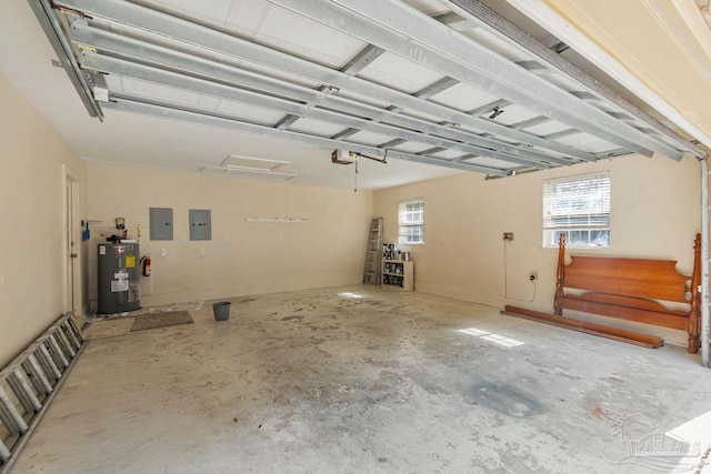 garage featuring electric panel, a garage door opener, and electric water heater