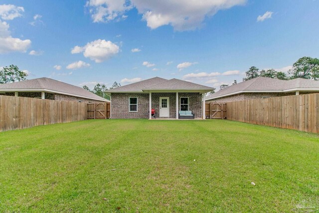 rear view of house with brick siding