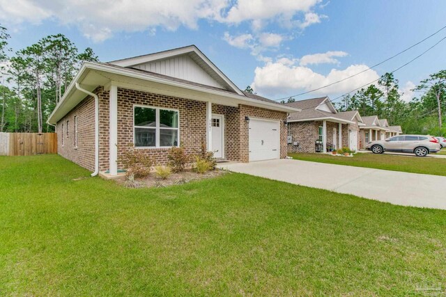 view of front of house featuring brick siding, an attached garage, driveway, and board and batten siding