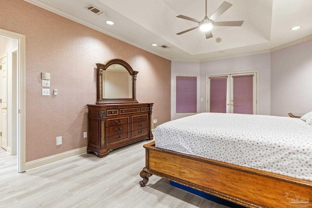 1126 Mary Kate Dr, Gulf Breeze, FL 32563 - bedroom featuring recessed lighting, a raised ceiling, visible vents, light wood-style floors, and crown molding