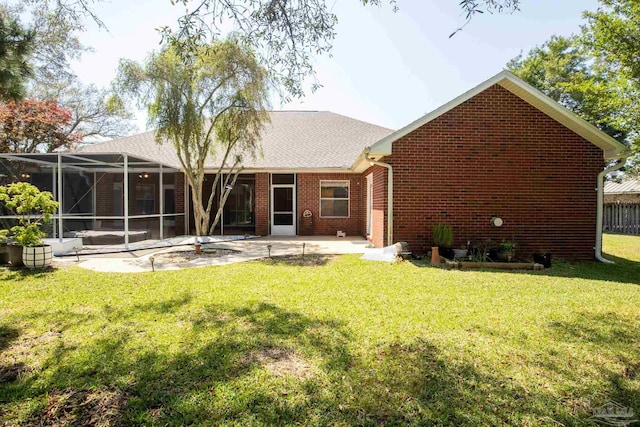 1126 Mary Kate Dr, Gulf Breeze, FL 32563 - rear view of property featuring brick siding, a yard, and a patio