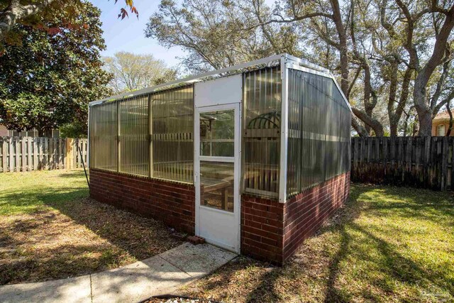 1126 Mary Kate Dr, Gulf Breeze, FL 32563 - view of greenhouse with a fenced backyard and a lawn
