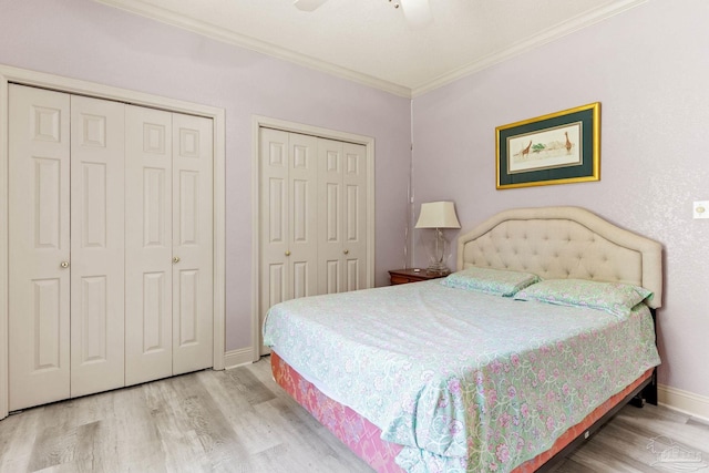 1126 Mary Kate Dr, Gulf Breeze, FL 32563 - bedroom featuring a ceiling fan, wood finished floors, two closets, baseboards, and ornamental molding