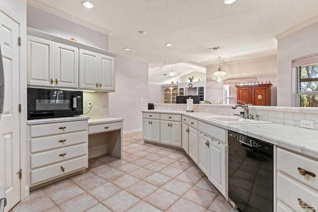 1126 Mary Kate Dr, Gulf Breeze, FL 32563 - kitchen featuring tile counters, vaulted ceiling, a sink, black appliances, and tasteful backsplash