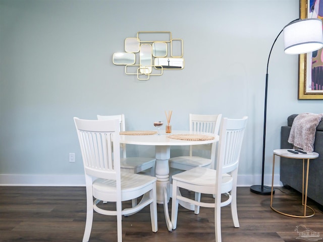 817 N D St, Pensacola, FL 32501 - dining area featuring baseboards and wood finished floors