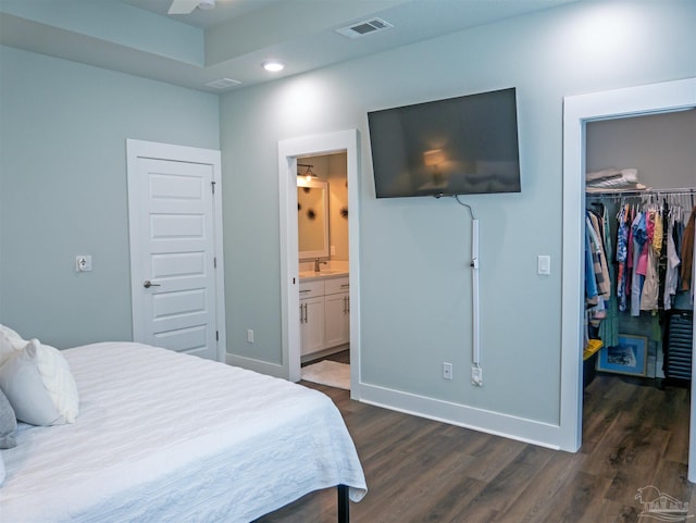 817 N D St, Pensacola, FL 32501 - bedroom with a closet, baseboards, a spacious closet, visible vents, and dark wood finished floors