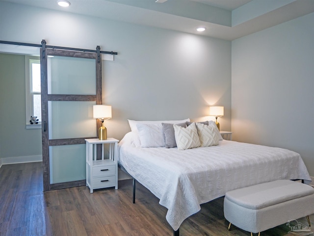817 N D St, Pensacola, FL 32501 - bedroom featuring dark wood-style flooring, baseboards, recessed lighting, and a barn door