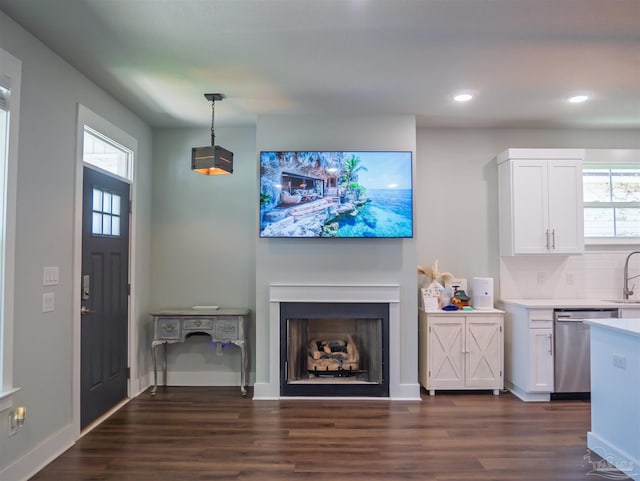 817 N D St, Pensacola, FL 32501 - living area with a fireplace, dark wood finished floors, baseboards, and recessed lighting