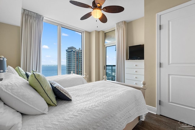 bedroom with dark hardwood / wood-style floors and ceiling fan