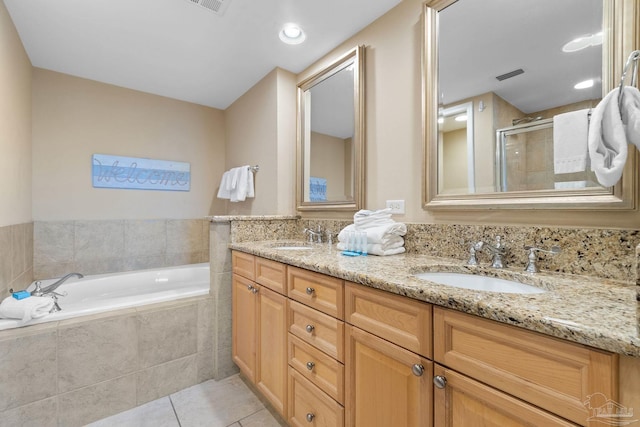 bathroom with vanity, independent shower and bath, and tile patterned flooring